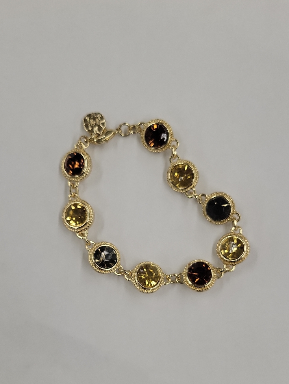 Monet Gold-Tone Bracelet with Amber, Yellow and Dark Gray Stones